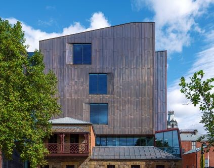 Bendigo Law Courts exterior A shiny new building sits behind a Victorian terrace house